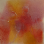 two figures within hazy red, orange, yellow color patches